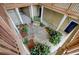 Top-down view of a tranquil courtyard with seating, plants, and access to units at 2121 Egret Crest Ln, Charleston, SC 29414
