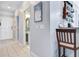 Hallway leading to a bathroom, with a coffee station area and tile flooring at 2121 Egret Crest Ln, Charleston, SC 29414