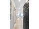 Bright hallway with tiled floor, leading to a living area, and a glimpse of natural light at 2121 Egret Crest Ln, Charleston, SC 29414