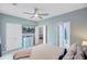 Spacious bedroom with white closets, ceiling fan, and view to ensuite bathroom at 2121 Egret Crest Ln, Charleston, SC 29414