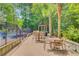 Community outdoor dining area with tables and seating next to the pool and lounge area at 2121 Egret Crest Ln, Charleston, SC 29414