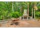 Stone fireplace and seating area perfect for outdoor entertaining, near the pool at 2121 Egret Crest Ln, Charleston, SC 29414