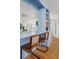 Stylish bar area with built-in shelving, seating, and a mirror backdrop at 2128 Golfview Dr, Charleston, SC 29412