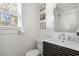 Modern bathroom featuring a sink, toilet, mirror, and walk-in shower, all in a clean and bright setting at 2128 Golfview Dr, Charleston, SC 29412