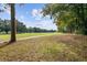 Expansive greenspace with walking path and mature trees, offering a picturesque setting for outdoor activities at 2128 Golfview Dr, Charleston, SC 29412