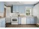 Functional kitchen with blue cabinetry and standard appliances at 2128 Golfview Dr, Charleston, SC 29412