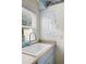 Charming laundry room with bright sink, blue cabinetry, decorative wall text, and lots of natural light at 2128 Golfview Dr, Charleston, SC 29412