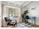 Bright home office featuring a desk, a comfortable chair, and a large bay window, perfect for a productive work environment at 2128 Golfview Dr, Charleston, SC 29412