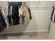 Walk in closet with clothes hanging on rack and grey carpet at 244 Tuscan Sun St, Summerville, SC 29485
