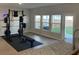 Home gym offers ample sunlight and open layout with premium work out equipment at 244 Tuscan Sun St, Summerville, SC 29485