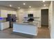 Modern kitchen boasts stainless steel appliances, island, and granite countertops at 244 Tuscan Sun St, Summerville, SC 29485
