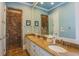 Elegant bathroom with a marble countertop, tiled shower, and a large vanity mirror at 25 Ocean Point Dr, Isle of Palms, SC 29451