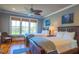Comfortable bedroom featuring two beds, wood floors, and scenic views through the window at 25 Ocean Point Dr, Isle of Palms, SC 29451