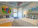 Bedroom with two beds, decorative pillows, and ocean themed artwork at 25 Ocean Point Dr, Isle of Palms, SC 29451