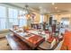 Elegant dining area with a large table, seating for eight, and bright windows at 25 Ocean Point Dr, Isle of Palms, SC 29451