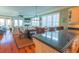 Open-concept kitchen flowing into the dining and living areas at 25 Ocean Point Dr, Isle of Palms, SC 29451
