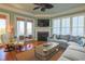 Comfortable living room with hardwood floors and fireplace at 25 Ocean Point Dr, Isle of Palms, SC 29451
