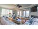 Bright and airy living room with ample seating and a fireplace at 25 Ocean Point Dr, Isle of Palms, SC 29451
