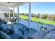 Outdoor seating area on a porch, overlooking water and a golf course at 25 Ocean Point Dr, Isle of Palms, SC 29451