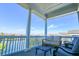 Seating area on a porch overlooking a waterway at 25 Ocean Point Dr, Isle of Palms, SC 29451