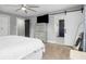 Bright bedroom with hardwood floors, stylish furniture, and bathroom access at 2864 Wofford Rd, Charleston, SC 29414