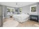 Bright bedroom with hardwood floors, stylish furniture, and large windows at 2864 Wofford Rd, Charleston, SC 29414