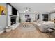 Cozy living room with a white-painted brick fireplace, plush seating, and stylish decor at 2864 Wofford Rd, Charleston, SC 29414