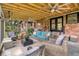 Covered back porch with wicker furniture and outdoor ceiling fans at 2864 Wofford Rd, Charleston, SC 29414