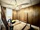 Unique bedroom featuring wood paneling and lots of natural light at 3 Hanover St, Charleston, SC 29403