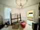 Bedroom featuring a decorative chandelier and doorway view into the kitchen at 3 Hanover St, Charleston, SC 29403