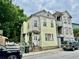 This home's exterior has peeling yellow paint and a small front porch at 3 Hanover St, Charleston, SC 29403