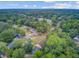 Panoramic aerial view of the neighborhood with beautifuly landscaped homes under a sunny sky, trees, and quiet streets at 300 Hamlet Rd, Summerville, SC 29485
