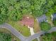 Overhead shot of a home with a well-manicured lawn, long driveway, and cozy backyard in a quiet neighborhood at 300 Hamlet Rd, Summerville, SC 29485