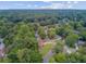 Beautiful aerial shot of a well-maintained neighborhood surrounded by mature trees and landscaped yards at 300 Hamlet Rd, Summerville, SC 29485