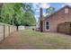 Expansive backyard with green lawn, a fence line, a shed, and mature trees at 300 Hamlet Rd, Summerville, SC 29485