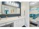 Stylish bathroom featuring a large mirror, vanity, and a shower with a turtle-themed curtain at 300 Hamlet Rd, Summerville, SC 29485