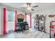 Well-lit bedroom with fan, study desk, and shelves at 300 Hamlet Rd, Summerville, SC 29485