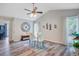Dining room featuring a glass table, a ceiling fan, and a nautical themed decor at 300 Hamlet Rd, Summerville, SC 29485