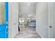 Bright entryway with wood-look floors, a chandelier, and a view into the spacious living area at 300 Hamlet Rd, Summerville, SC 29485