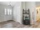 Inviting foyer featuring wood-look flooring, a charming shelf, and views of the living spaces at 300 Hamlet Rd, Summerville, SC 29485