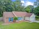 Attractive one-story home with a combination brick and siding exterior, a tidy lawn, and blue shutters at 300 Hamlet Rd, Summerville, SC 29485
