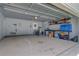 Spacious two-car garage with ample storage space, shelving, and a dart board at 300 Hamlet Rd, Summerville, SC 29485