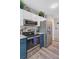 A kitchen including stainless steel appliances and white and blue-gray colored cabinets at 300 Hamlet Rd, Summerville, SC 29485