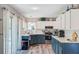 Modern kitchen with white subway tile backsplash, stylish two-tone cabinets, and stainless appliances at 300 Hamlet Rd, Summerville, SC 29485