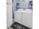 Charming laundry room with blue walls, decor and a front-loading washer and dryer at 300 Hamlet Rd, Summerville, SC 29485