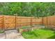 Image of the backyard featuring a wooden fence, small garden, and grass, creating a private outdoor space at 302 Springview Ln # 10, Summerville, SC 29485