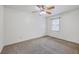 Carpeted bedroom with a window, a ceiling fan, and neutral walls at 302 Springview Ln # 10, Summerville, SC 29485