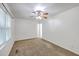 Spacious carpeted bedroom features natural light from the window and ceiling fan at 302 Springview Ln # 10, Summerville, SC 29485