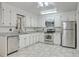Bright kitchen featuring granite countertops, stainless steel appliances, and white cabinets at 302 Springview Ln # 10, Summerville, SC 29485