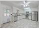 Open kitchen featuring stainless steel appliances, white cabinets, and a door to the outside at 302 Springview Ln # 10, Summerville, SC 29485